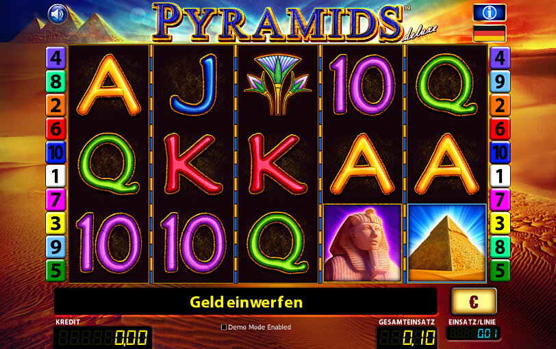 Die Spielwalzen in RTG's Spiel Pyramids Deluxe vor Wuestenlandschaft.